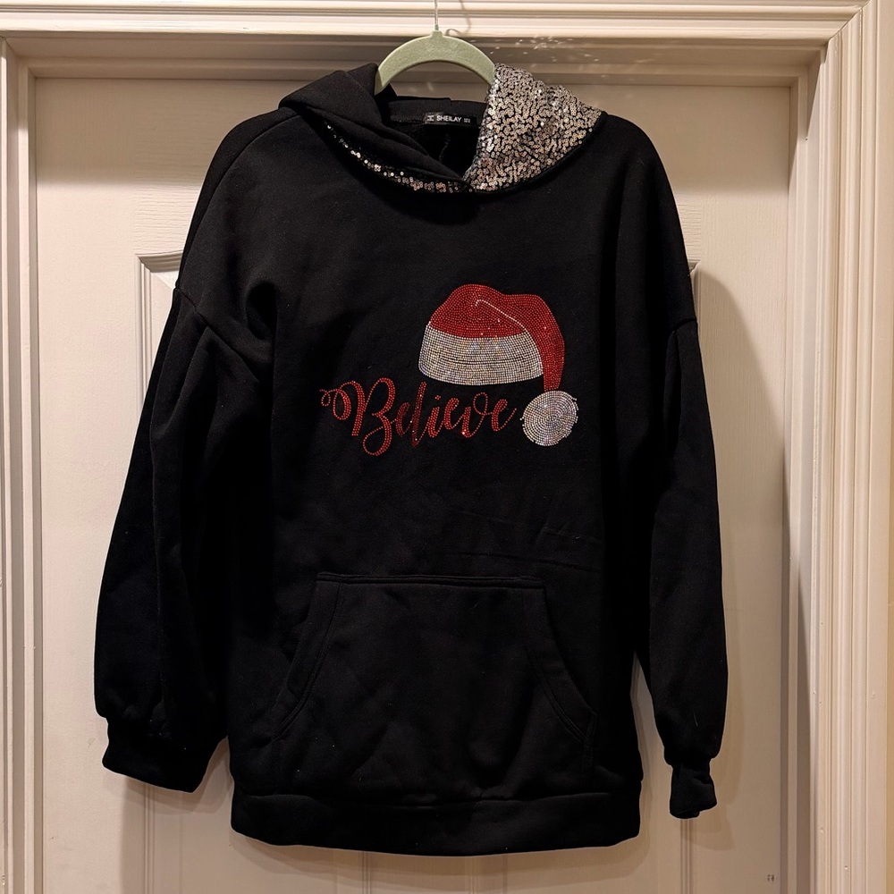 Black 'Believe' Hoodie with Santa Hat Design